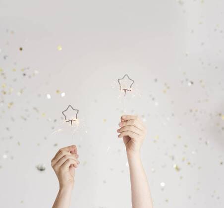 Woman s hands holding sparklers model released Symbolfoto  ABIF00890