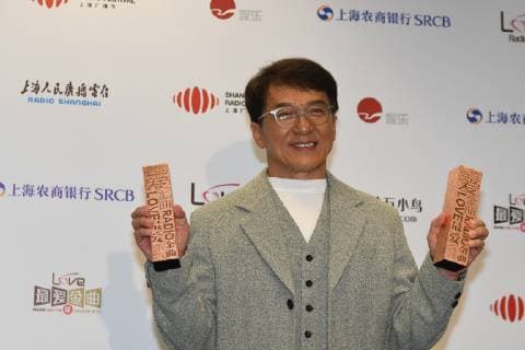 Hong Kong kungfu superstar Jackie Chan poses with his trophies during the 2018 Love Radio Music Awards ceremony in Shanghai, China, 26 September 2018. Jackie Chan wins big at Love Radio Music Awards in Shanghai  20180926_56993