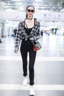 Chinese model Xi Mengyao, better known as Ming Xi, arrives at the Beijing Capital International Airport before flying to France for the Paris Fashion Week Spring Summer 2019 in Beijing, China, 26 September 2018. Ming Xi flashes stunning slim figure in trendy outfit at Beijing airport ahead of Paris Fashion Week  pbu874356_01