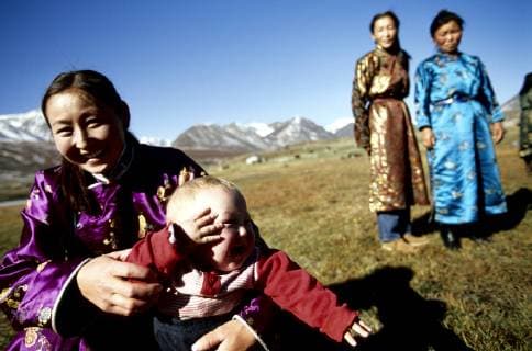 Portrait of a Kazakh women in traditional dressing. Most of the nomads living in the Tavanbogd Atlai National Park are Kazakhs. All babies have blond hairs that will darken a few months later., Tavanbogd National Park Mongolia Copyright: OlivierxRenck 7282600037