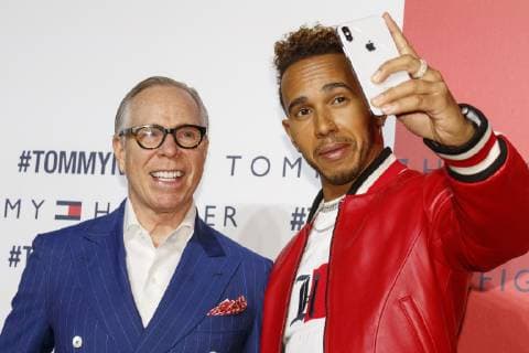 (L to R) American fashion designer Tommy Hilfiger and F1 racer Lewis Hamilton pose for a selfie during Tokyo Icons event on October 8, 2018, Tokyo, Japan. The American fashion brand presented its Fall 2018 collection in Tokyo inviting international and Japanese celebrities such as F1 race driver Lewis Hamilton and model and Justin Bieber s wife Hailey Baldwin.  (gxta_THJIcons042)