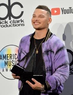Singer Kane Brown appears backstage with his award for Favorite Male Artist - Country, during the 46th annual American Music Awards at the Microsoft Theater in Los Angeles on October 9, 2018.  LAP20181009587 JIMxRUYMEN