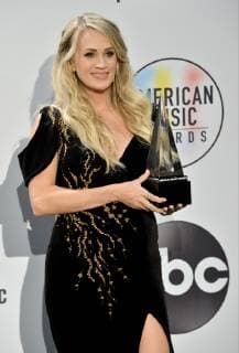 Singer Carrie Underwood appears backstage with her award for Favorite Female Artist - Country, during the 46th annual American Music Awards at the Microsoft Theater in Los Angeles on October 9, 2018.  LAP20181009606 JIMxRUYMEN