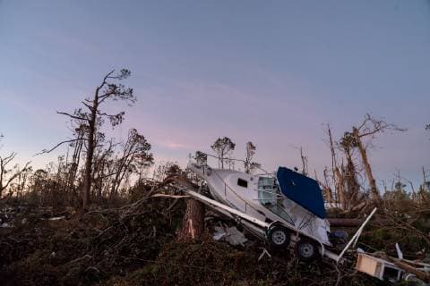 A boat leans up against a fallen tree after Hurricane Michael slammed into Mexico Beach, Florida October 12, 2018. Michael hit the Florida panhandle October 10.  WAP20181012062 KENxCEDENO