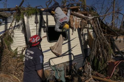 South Florida Task Force Two Search and Rescue Team checks a trailer for survivors after Hurricane Michael hit the Florida panhandle and worst Mexico Beach, Florida October 13, 2018. Michael hit the Florida coast October 10 as a Category 4 near Mexico Beach as the most powerful storm to hit the southern US state in more than a century.  WAP20181013001 KENxCEDENO
