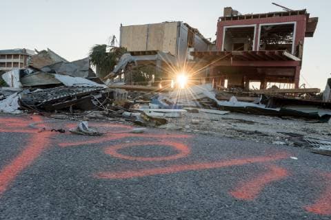 Debris from damaged homes after Hurricane Michael lay strewn about in the early morning in Mexico Beach, Florida October 13, 2018.  WAP20181013505 KENxCEDENO