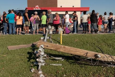 Local residence wait in line of the parking lot of Arby s for free food and drinks after Hurricane Michael hit in Panama City, Florida October 13, 2018.  WAP20181013547 KENxCEDENO