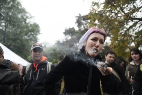 October 17, 2018 - Toronto, Canada - A pot smoker smoking a joint during the Cannabis Legalization Day celebration in Toronto, Canada. Recreational marijuana became legal in Canada on 17th October, 2018. To celebrate the day people gathered at Trinity Bellwoods Park around noon. The party continued until late in the evening in Toronto, Canada. Toronto Canada  - ZUMAn230 20181017_zaa_n230_667 Copyright: xArindamxShivaanix