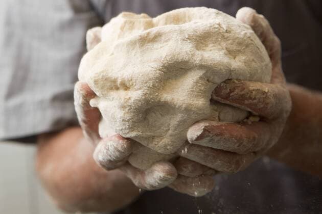 Man s hands holding fresh bread dough  Copyright: IsabellexRozenbaum B06222627