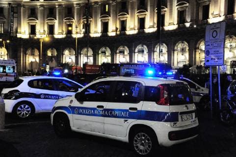 (181023) -- ROME, Oct. 23, 2018 -- Police cars are seen outside the metro station where an escalator collapsed in Rome, Italy, on Oct. 23, 2018. At least 20 Russian football fans were injured when an escalator at a busy Rome metro station collapsed on Tuesday night, local media reported. ) ITALY-ROME-METRO-ESCALATOR-COLLAPSE ChenxZhanjie 