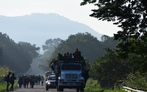 October 24, 2018 - Mapastepec, Chiapas, Mexico - Thousands of Central American migrants continued their journey toward the US border Thursday, reaching the coastal town of Mapastepec, in Chiapas, Mexico, An estimated 7,200 migrants from Honduras and other countries have pressed on, sleeping on roads, traveling on rafts, going without food and water and facing police and threats from President Trump, who called them a threat and vowed to send troops to the border with Mexico. Mapastepec Mexico - ZUMAl113 20181024_zap_l113_021 Copyright: xMiguelxJuarezxLugox