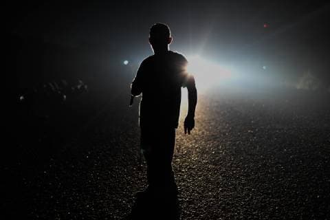 October 27, 2018 - San Pedro Tapantepec, Oaxaca, Mexico - A caravan of Central American migrants walked and hitchhiked trying to reach the town of Tapantepec in Oaxaca state, Saturday. A handicap in the middle of the highway waits for a lift. President Trump has vowed to stop them. San Pedro Tapantepec Mexico - ZUMAl113 20181027_zap_l113_003 Copyright: xMiguelxJuarezxLugox