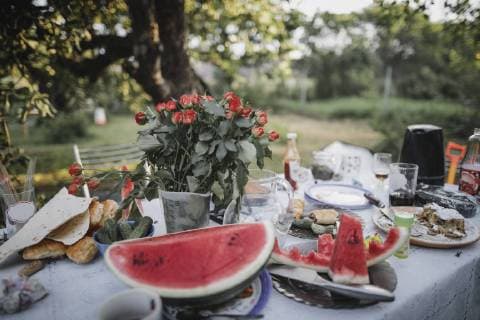 Table with leftovers of garden party property released  KMKF00525