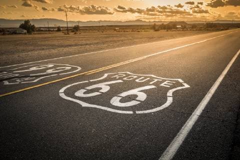 Route 66 Road Marker Painted On The Historic Highway, Amboy California USA Copyright: PaulxGiamou GIPA000195