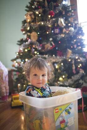 Playing by the Christmas tree., Chicago IL United States model released Symbolfoto Copyright: BethxRooney ROBE000442