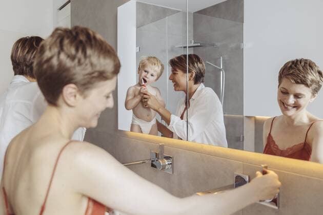 Lesbian couple and their little son getting ready for their day in the bathroom model released Symbolfoto property released  MFF04448