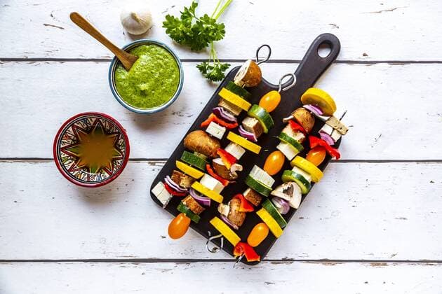 Vegetarian grill skewers, tomato, yellow and green zucchini, tofu, feta, onion and champignon, Argentinian chimichurri  SARF03923