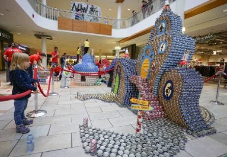 (181104) -- VANCOUVER, Nov. 4, 2018 -- A child takes a look at a can sculpture during the Canstruction event in Vancouver, Canada, Nov. 3, 2018. Some 13 teams competed with their sculpture designs by using donated cans in the annual event. ) (lrz) CANADA-VANCOUVER- CANSTRUCTION EVENT LiangxSen 