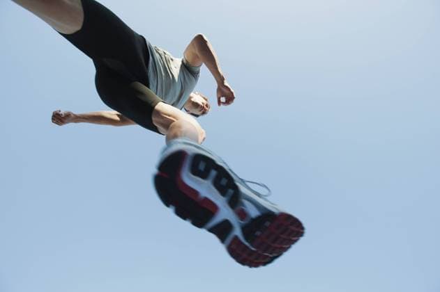 Runner in mid-stride, viewed from directly below  Copyright: OdilonxDimier B01116125