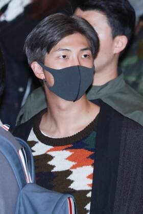 A member of South Korean boy band BTS, also known as the Bangtan Boys arrives at the Gimpo International Airport in Seoul, South Korea, 10 November 2018. BTS members show up in low profile at Gimpo airport  20181111_57432