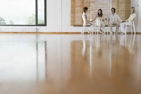 Patients holding hands during group therapy session  Copyright: AlixxMinde B41443121