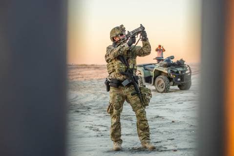 Nov 14, 2018 - Tijuana, Mexico - US Border Patrol agent stands ready to fire if asylum seekers from Central America, aka the Migrant Caravan , act dangerous while atop the border fence US Mexico border in Tijuana. Tijuana Mexico - ZUMAs157 20181114_tim_s157_014 Copyright: xVitoxDixStefanox