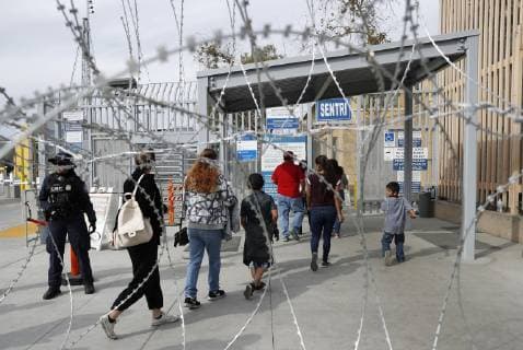 Migrant caravan Migrants from Central America queue to enter the United States after passing through a checkpoint in Tijuana on the Mexican side of the border on Nov. 19, 2018. 