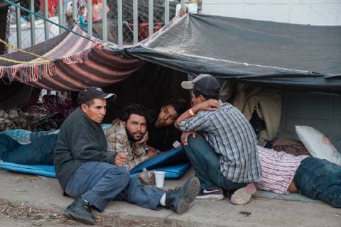 Migrants that are part of the caravan from Central America camp outside of the makeshift migrant shelter at Unidad Deportiva Benito Juarez Stadium on November 26, 2018 in Tijuana, Mexico. Sunday afternoon, some migrants protesting a backlog of asylum claims rushed toward the border and were met with tear gas.  TIJ2018112616 ARIANAxDREHSLER