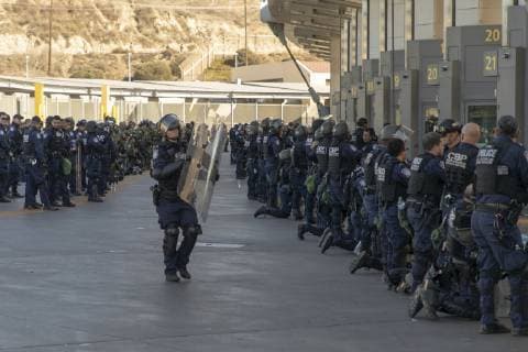 November 26, 2018 - San Ysidro, CA, United States of America - U.S. Customs and Border Patrol agents in riot gear alongside U.S. army soldiers shut the border into the United States from Mexico at the San Ysidro crossing after members of the migrant caravan attempted to illegally cross November 26, 2018 in San Ysidro, California. San Ysidro United States of America - ZUMAp138 20181126_zaa_p138_022 Copyright: xManixAlbrechtx