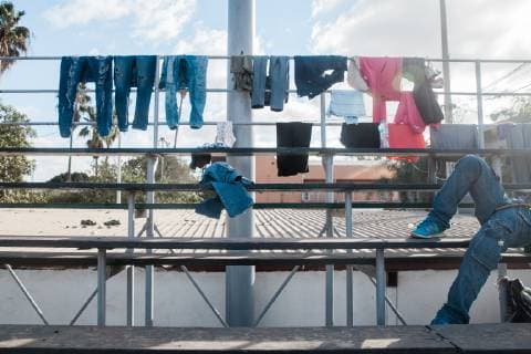 Laundry hangs on the top of bleachers at Benito Juarez shelter, now housing more than 5,800 migrants in Tijuana, Mexico on November 28, 2018.  TIJ20181128218 ARIANAxDREHSLER