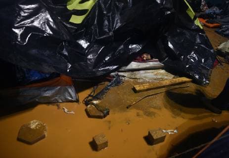 November 29, 2018 - Tijuana, Mexico - People navigate severe flooding at the migrant caravan camp Centro Deportivo Benito Juarez on November 29, 2018. It is being called a humanitarian crisis. We lost everything, said a migrant walking through debris. Many migrants appeared to realize that the hope they held to begin a new life in America had dimmed and their stay in Mexico may be longer than anticipated. Tijuana Mexico - ZUMAg208 20181129_zap_g208_021 Copyright: xCarolxGuzyx