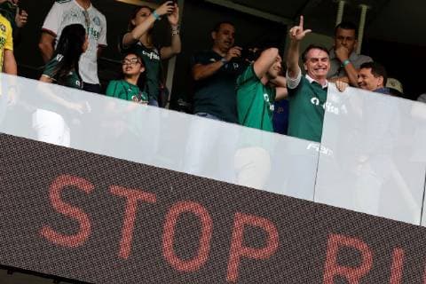 The elected president of Brazil, Jair Bolsonaro, wearing the Palmeiras Club shirt, greets supporters before the start of the match between Palmeiras and Vitoria for the Brazilian soccer championship, at the Allianz Parque stadium in Sao Paulo, Brazil, 02 December 2018. Palmeiras was proclaimed last Sunday, November 25, the Brazilian league champion for the tenth time and got it one date before the end of the tournament after beating Vasco da Gama at home by 1-0. Bolsonaro will assume the Brazilian Presidency next 01 January. Bolsonaro attends the match of the proclaimed champion of the Brazilian League, Palmeiras, against Vitória in Sao Paulo !ACHTUNG: NUR REDAKTIONELLE NUTZUNG! Copyright: xSebastiaoxMoreirax AME4423 20181202-636793809246634414