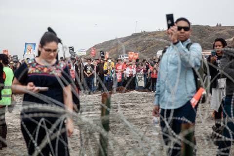 More than 300 demonstrators including leaders of churches, synagogues, mosques, and indigenous communities, walk toward the border fence at Border Field State Park in San Diego, California on December 10, 2018. The demonstration is to show support for the migrants who wish to seek asylum in the United States.  SDP2018121015 ARIANAxDREHSLER