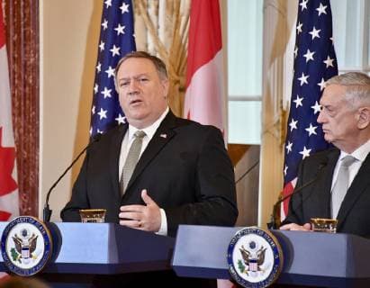 December 14, 2018 - Washington, DC, United States of America - U.S. Secretary of State Mike Pompeo, left, and U.S. Secretary of Defense James Mattis speak during a joint press conference with Canadian Minister of Foreign Affairs Chrystia Freeland and Canadian Minister of Defense Harjit Sajjan during the U.S. Ã¢â‚¬ Canada 2+2 Ministerial meeting at the Department of State December 14, 2018 in Washington, D.C. Washington United States of America - ZUMAp138 20181214_zaa_p138_004 Copyright: xMichaelxGrossx