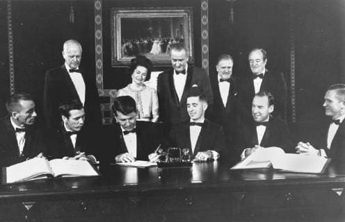 December 3, 1968 - Washington, District of Columbia, U.S. - Apollo 7 and 8 flight crews sign a commemorative document to be hung in the Treaty Room of the White House honoring the occasion. Those signing are from left to right: Apollo 7 Astronauts: Walter Cunningham, Donn F. Eisele, and Walter M. Schirra. Apollo 8 Astronauts: William A. Anders, James A. Lovell, Jr., and Frank Borman. Standing are: Charles A. Lindbergh (also a signer) Lady Bird Johnson President Lyndon B. Johnson Administrator James E. Webb, Vice President Hubert H. Humphrey. Washington U.S. - ZUMAz03_ 19681203_shk_z03_626 Copyright: xNASAx