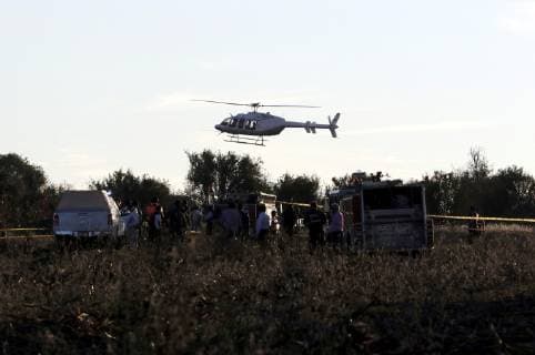(181225) -- PUEBLA, Dec. 25, 2018 -- Security members work at the helicopter crash site in Coronango, Puebla, Mexico, Dec. 24, 2018. The governor of Mexico s central state of Puebla, Martha Erika Alonso, and her husband Rafael Moreno Valle, ex-governor of the state, were killed in a helicopter crash on Monday, the head of the National Action Party Marko Cortes confirmed. ) (rtg) MEXICO-PUEBLA-ACCIDENT-HELICOPTER CRASH STR