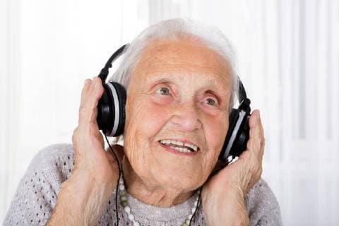  Senior Woman Using Headphone At Home model released Symbolfoto  Copyright: xAndreyPopovx Panthermedia19110861