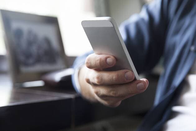 Man text messaging  Copyright: SigridxOlsson B02772223
