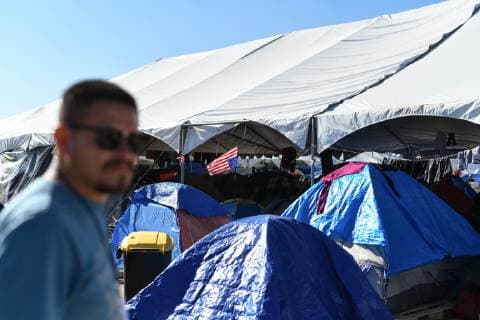 (190110) -- TIJUANA, Jan. 10, 2019 -- A migrant is in a temporary transit center for migrants from Central America in Tijuana, Mexico, Jan. 9, 2019. A large number of migrants from Central America gathered in Mexican border city Tijuana wishing to enter the United States. ) MEXICO-TIJUANA-MIGRATION-CENTRAL AMERICA-U.S. XinxYuewei 
