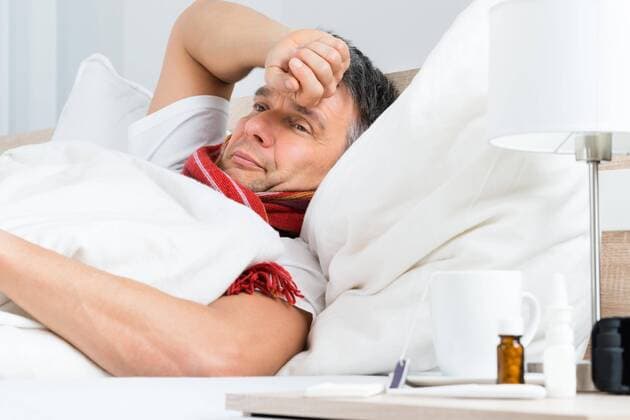  Sick Mature Man Lying On Bed In Bedroom model released Symbolfoto  Copyright: xAndreyPopovx Panthermedia13804557