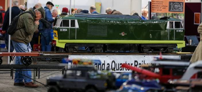 January 18, 2019 - London, United Kingdom - An enthusiasts is seen viewing a locomotive at the annual London Model Engineering Exhibition at Alexandra Palace, north London. Over 50 clubs and societies are exhibiting full spectrum of modelling from traditional model engineering, steam locomotives and traction engines through to the more modern gadgets including trucks, boats, aeroplanes and helicoptersÃäwith nearly 2,000 models constructed by their members. London United Kingdom - ZUMAs197 20190118_zaa_s197_073 Copyright: xDinendraxHariax