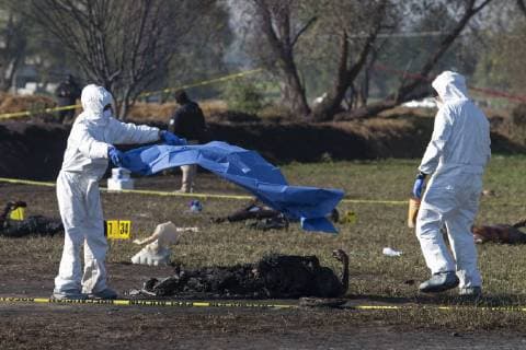 January 19, 2019 - Tlahuelipan, Hidalgo, MEXICO - Saturday, January 19, 2019. Experts from the General Prosecutor Office of Mexico are working on the recovery and identification of bodies in the area where yesterday a Pemex pipeline exploded by a clandestine taking of the gasoline by of huachicoleros that went out of control and left 67 dead, so far, in the San Primitivo community, municipality of Tlahuelilpan, Hidalgo. ANTONIO NAVA PI Tlahuelipan MEXICO - ZUMAp124 20190119_zaa_p124_037 Copyright: xAntonioxNavax