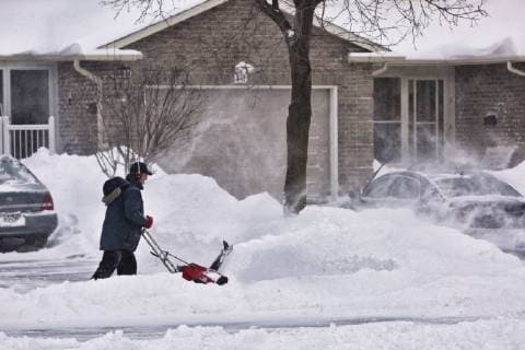 January 29, 2019 - Toronto, Ontario, Canada - Man uses a snow-blower to clear snow from his driveway after a massive snowstorm hit Toronto, Ontario, Canada, on January 28, 2019. The storm dropped between 15-25 centimeters of snow across the Greater Toronto Area and broke the record for snowfall amount set in January 2009, with more than 22cm falling before midnight yesterday. Toronto Canada  - ZUMAn230 20190129_zaa_n230_519 Copyright: xCreativexTouchxImagingxLtdx