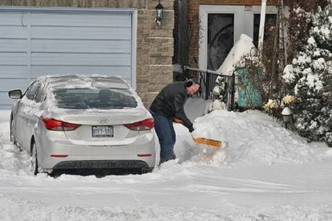 January 29, 2019 - Toronto, Ontario, Canada - Man shovels snow from his driveway after a massive snowstorm hit Toronto, Ontario, Canada, on January 28, 2019. The storm dropped between 15-25 centimeters of snow across the Greater Toronto Area and broke the record for snowfall amount set in January 2009, with more than 22cm falling before midnight yesterday. Toronto Canada  - ZUMAn230 20190129_zaa_n230_478 Copyright: xCreativexTouchxImagingxLtdx