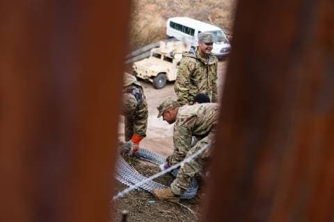 February 6, 2019 - Nogales, United States - U.S. Military troops add concertina wire to the border wall in Nogales, Arizona on February 6, 2019. Troops began adding additional rows of wire to downtown Nogales this past Saturday and have continued to add more rows this week in and around Nogales while local officials are asking for the wire to be removed. Nogales United States  - ZUMAn230 20190206_zaa_n230_812 Copyright: xMaxxHermanx