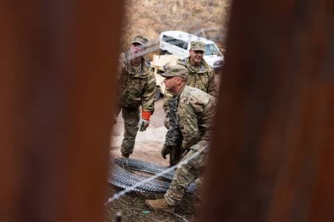 February 6, 2019 - Nogales, United States - U.S. Military troops add concertina wire to the border wall in Nogales, Arizona on February 6, 2019. Troops began adding additional rows of wire to downtown Nogales this past Saturday and have continued to add more rows this week in and around Nogales while local officials are asking for the wire to be removed. Nogales United States  - ZUMAn230 20190206_zaa_n230_813 Copyright: xMaxxHermanx