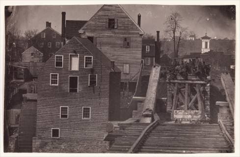 End of the Bridge after Burnside s Attack, Fredericksburg, Virginia, 1863, Albumen silver print from glass negative, Image: 13.1 × 20.6 cm (5 3 16 × 8 1 8 in.), Photographs, Andrew Joseph Russell (American, 1830–1902), Likely made in April 1863 during a truce just before the Battle of Chancellorsville, this view from the buttress of a ruined railroad bridge spanning the Rappahannock River at Fredericksburg documents a small group of Confederate soldiers and civilians  Copyright: Artokoloro AM170720_055128