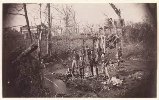 Orange and Alexandria Railroad Bridge, near Union Mills, Virginia , ca. 1863, Albumen silver print from glass negative, Image: 12.3 x 20.1 cm (4 13 16 x 7 15 16 in.), Photographs, Andrew Joseph Russell (American, 1830–1902), A. J. Russell, a captain in the 141st New York Infantry Volunteers, was one of the few Civil War photographers who also was a soldier. As a photographer-engineer for the U.S. Military Railroad Construction Corps, Russell was responsible for recording both the technical accomplishments of General Herman Haupt s engineers and the battlefields and campsites in Virginia  Copyright: Artokoloro AM170720_055134