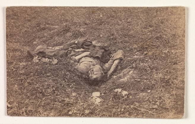 Confederate Soldier on the Battlefield at Antietam , September 1862, Albumen silver print from glass negative, Image: 6.1 x 9.8 cm (2 3 8 x 3 7 8 in.), Photographs, Alexander Gardner (American, Glasgow, Scotland 1821–1882 Washington, D.C.), The Battle of Antietam (named after a creek near Sharpsburg, Maryland) occurred on September 17, 1862, and was known as the bloodiest single day of the war. More than 26,000 soldiers on both sides were wounded or killed, including this Confederate soldier, who, according to the caption added by the Mathew Brady studio, after being wounded, had dragged himself to a little ravine on the hillside, where he died  Copyright: Artokoloro AM170720_055144