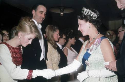 Queen Elizabeth II meets French actress Catherine Deneuve at a Royal film Performance. Also present are (left to right) Christopher Lee, Ursula Andress, Woody Allen and Raquel Welch (1966) File Reference 33751_169THA  Copyright: xCinemaxLegacyxCollection ThexHollywoodxArchivex 33751_169THA The Hollywood Archive